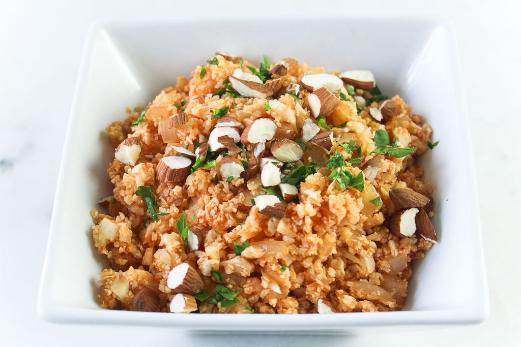 Spanish-Style Cauliflower Rice in a white square bowl