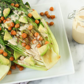 Grilled Caesar Salad with Creamy Lemon Tahini Dressing - try grilling greens for a whole new salad experience via Chef Julie Harrington @ChefJulie_RD #salad #caesarsalad #vegan #vegetarian #caesar #plantbased #dressing #tahini #glutenfree