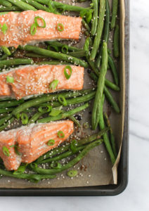 miso salmon and green beans on a baking sheet
