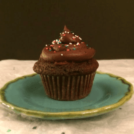single serve chocolate cupcake on a blue plate