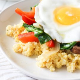Cheesy Millet with Sautéed Vegetables and Fried Egg