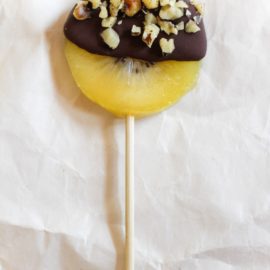 Dark Chocolate Covered Kiwi Pop on parchment paper