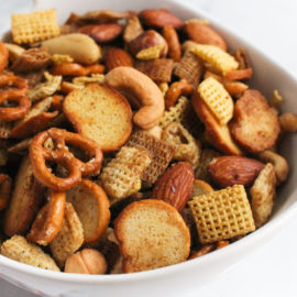 savory chex mix in a white bowl