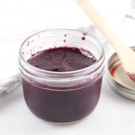 Small mason jar filled with blueberry jam