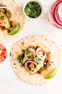 open-faced tacos with beef barbacoa