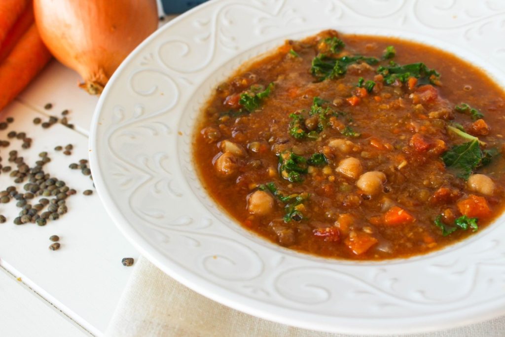 lentil soup in a decorative white bowl